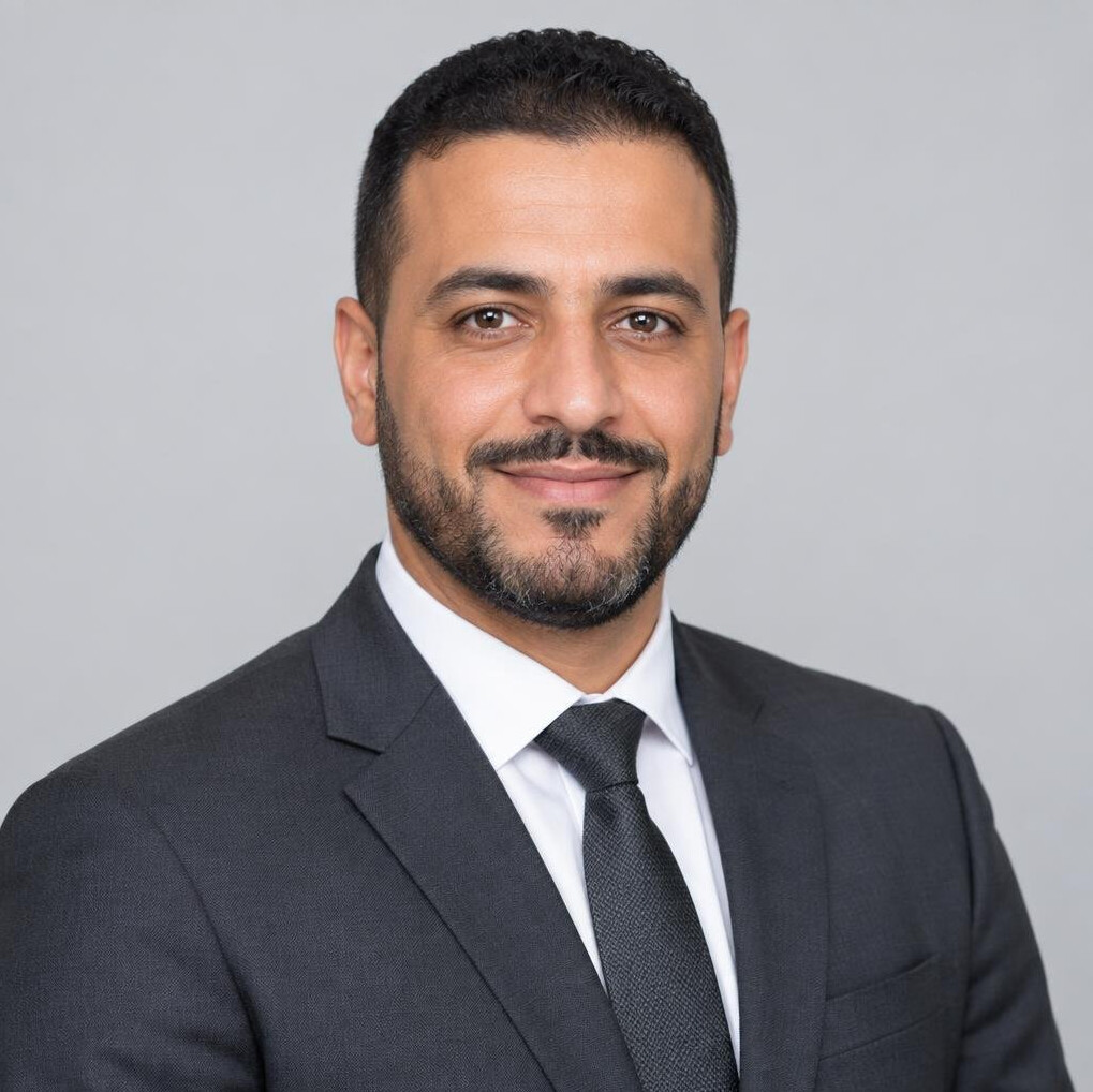 Studio portrait of a man of North African descent wearing a business suit