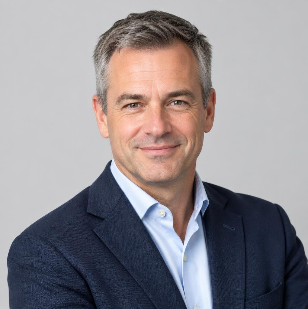 Studio portrait of a Flemish man in his forties wearing business casual attire